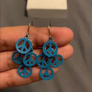 Blue peace sign dangly earrings